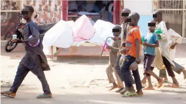  ??  ?? Another group of almajiris roaming the street