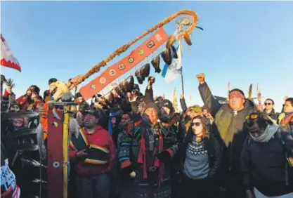  ?? Helen H. Richardson, The Denver Post ?? Protesters celebrate their victory Sunday in Cannon Ball, N.D., after Sioux Chief Arvol Looking Horse announced the Army Corps of Engineers will no longer grant an easement for the Dakota Access pipeline.