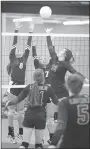  ?? ANDY SHUPE NWA DEMOCRAT-GAZETTE ?? Lincoln’s Hollie Webb (No. 32) tries to tip the ball over the net as Shiloh Christian’s Kate Turpin (No. 8) and Jentry Lantzsch elevate for the block during a Sept. 12 match at Lincoln. Webb garned All-Conference honors in volleyball and has been...