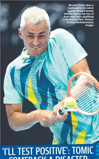  ?? Picture: Graham Denholm/Getty Images ?? Bernard Tomic plays a backhand in his match against Russia’s Roman Safiullin during day two of Australian Open qualifying at Melbourne Park.