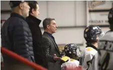  ?? JOHN RENNISON THE HAMILTON SPECTATOR PHOTOS ?? Left, Burlington Cougars coach Mark Jooris questions the lack of penalty call during a game at Central Arena against the Milton Menace.