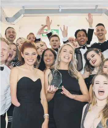  ?? ?? DOING THE DOUBLE The Carrington West team, who won Training Programme of the Year and Large Business of the Year, with Lauren Steadman MBE (second left, front)