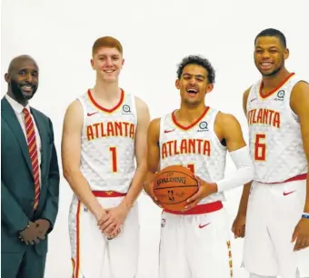  ?? THE ASSOCIATED PRESS ?? Atlanta Hawks coach Lloyd Pierce, left, expects to learn a lot about first-round draft picks Kevin Huerter (1), Trae Young and Omari Spellman (6) during the summer league.