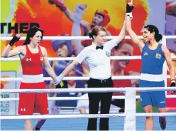  ?? HT PHOTO ?? India’s Manisha Maun (right) celebrates her win over Christina Cruz of USA at the IG Stadium in New Delhi on Friday.