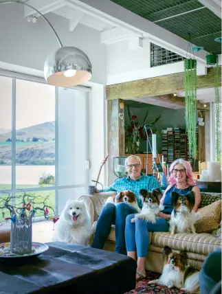  ??  ?? THIS PAGE: How to beat the empty nest syndrome? Get papillons and a samoyed. And a cat. ( From left) Keisha the samoyed, Fred with his favourite papillon, Poppy on his lap, Gemma on Dianne’s knee, Polly on the couch and Kia on the floor. Chilla the cat...