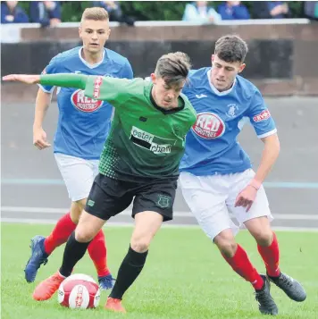  ??  ?? BACK IN THE FOLD: Dan Trickett-smith, centre, started the game against Stoke City on Tuesday night although he did miss from the penalty spot.