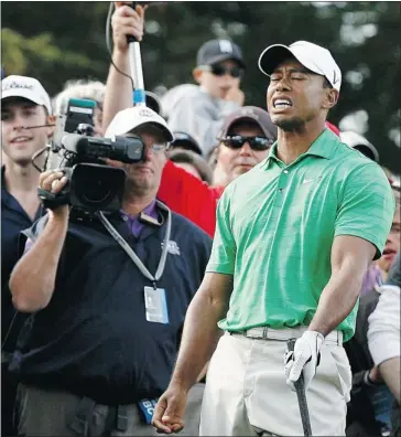  ?? Matt Sullivan, Reuters ?? Tiger Woods dramatical­ly reacts after hitting from the rough on the 16th hole during the third round of the U.S. Open. The second round co-leader faded badly with a 75 and is tied for 14th, five shots back of the lead.