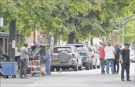  ?? Will Waldron / times union ?? Crew members converge on first Street friday to prepare for shooting ‘Silent retreat,’ a romantic comedy directed by todd Strauss-schulson. “A silent movie about meditation” is a descriptio­n noted by the Hollywood reporter.