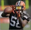  ?? TONY DEJAK — ASSOCIATED PRESS ?? Browns linebacker Christian Kirksey catches during a training camp practice last season.