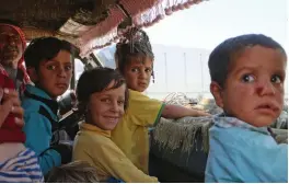  ?? — AFP ?? A Syrian family rides in a vehicle as they head to safer areas in the northern part of Syria's rebel- held Idlib province on Thursday.