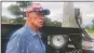  ?? Rick Romancito ?? Tom White explains the reason for his quiet protest in front of the Taos County complex and courthouse Wednesday (Aug. 22).