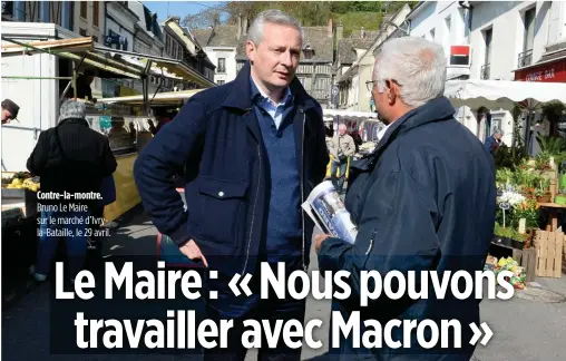  ??  ?? Contre-la-montre. Bruno Le Maire sur le marché d’Ivryla-Bataille, le 29 avril.