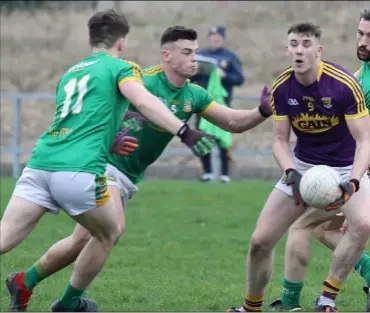  ??  ?? Impressive Wexford midfielder Niall Hughes is outnumbere­d by Meath trio Darragh Campion, Gavin McCoy and