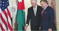  ?? (Reuters) ?? US SECRETARY OF STATE Rex Tillerson welcomes Jordan’s King Abdullah at the State Department yesterday.