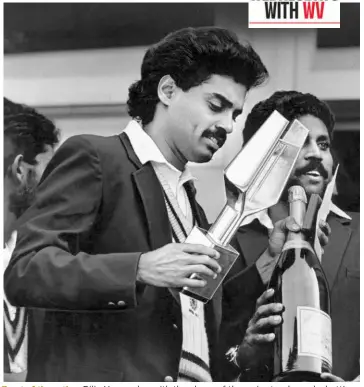  ?? THE HINDU PHOTO LIBRARY ?? Toast of the nation: Dilip Vengsarkar with the player of the series trophy and a bottle of champagne in Edgbaston in July, 1986, after India’s 2-0 series win against England. Vengsarkar scored 360 runs in three Tests at an average of 90. Between 1986 and 1988, he scored 1800 runs in 20 Tests, with eight centuries.