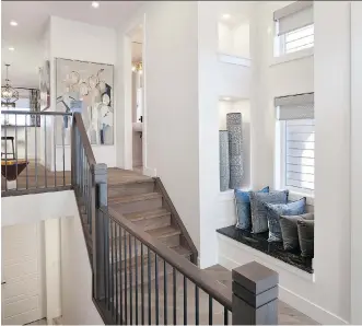 ??  ?? The foyer in the Onyx show home is set off nicely by a split stairway that echoes classic split-level style.