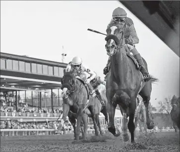  ?? ?? KENTUCKY DERBY WINNER Authentic thunders down the stretch on the way to victory in the Breeders’ Cup Classic. It was the first victory in the $6-million race for veteran jockey John Velazquez.