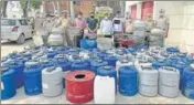  ?? HT PHOTO ?? Police seized 1,18,400 kg of ‘lahan’, 390-litre of illicit liquor, eight stills and 94 drums during the search operation.