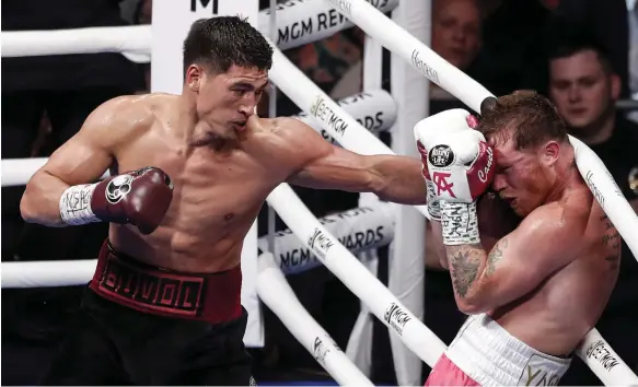  ?? EPA ?? Dmitry Bivol lands a punch on Saul ‘Canelo’ Alvarez during their title fight at the T-Mobile Arena in Las Vegas on Saturday