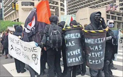  ?? AP PHOTO ?? Protesters march in a May Day demonstrat­ion on Monday near City Hall in Philadelph­ia.