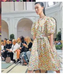  ?? PHOTO: ANGELA WEISS/AFP ?? A round shoulder garden party dress by Tory Burch