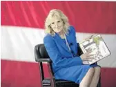  ?? REBECCA BLACKWELL/AP ?? First lady Jill Biden reads aloud at U.S. Coast Guard Air Station Miami on Friday.
