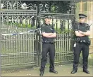  ??  ?? Police stand guard at Queen’s Park gates after the 2008 tragedy
