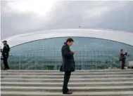  ?? CHRISTOPHE­R REYNOLDS/MCT ?? As Sochi readies for its close-up, media prep at the Bolshoy Ice Dome, the hockey venue for this year’s Winter Games.