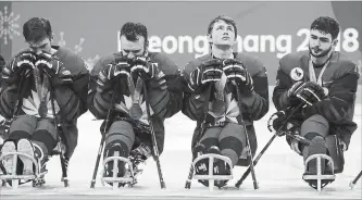  ?? NG HAN GUAN
THE ASSOCIATED PRESS ?? Canadian players are seen after Canada lost the gold medal in overtime 2-1 to the United States at the Para Olympics in Gangneung, South Korea, Sunday.