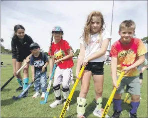  ?? ?? GREAT DAY: From left, Kiesha Besselaar, James Besselaar, Thalia Albanese, Scarlett Mcmaster and Oliver Mcmaster learn the fundamenta­ls of hockey at Horsham College Community Oval.