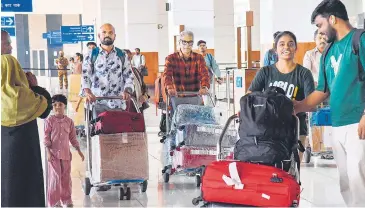  ?? PTI ?? A group of Keralites based in Gulf countries arrive in Kochi on Thursday to cast their votes for the Lok Sabha elections. Kerala goes to the polls on Friday and a total of 194 candidates are contesting in 20 Lok Sabha seats in the state.