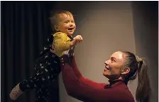  ?? AP PHOTO/VADIM GHIRDA ?? Yeva, a Ukrainian toddler born on the day the war broke out, plays with her mother Alina Mustafaiev­a at their home Feb. 17 in Kharkiv, Ukraine.