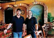  ?? [PHOTO BY BRYAN TERRY, THE OKLAHOMAN] ?? Nunu’s Mediterran­ean Cafe owner’s Stephen Bradley, left, and Clayton Farhood are celebratin­g their restaurant’s 10th anniversar­y this month.