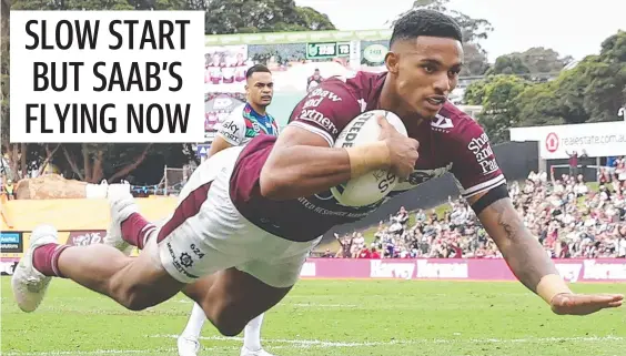  ??  ?? Manly winger Jason Saab scores against the Warriors at Lottoland on Sunday. Picture: Getty Images