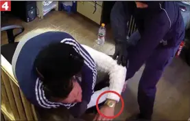  ??  ?? The second robber reaches for Mr James’s Rolex watch, circled
n4