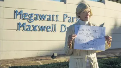  ?? Picture: Yeshiel Panchia ?? MESSENGER. A woman outside Megawatt Park in Sunninghil­l yesterday where members of the DA and Cope protested against the reinstatem­ent of Brian Molefe as CEO of Eskom.