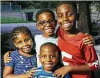  ?? Family photo ?? The Mitchell children, Kaila, 6, clockwise from left, Adrian, 10, Terrance “TJ,” 13, and Kyle, 5. All the children except Adrian died in the fire. Adrian was taken to the hospital in critical condition.