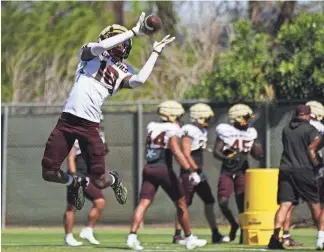  ?? PATRICK BREEN/THE REPUBLIC ?? ASU defensive back Chris Johnson II catches a pass during a spring practice last week at the Kajikawa practice fields in Tempe.