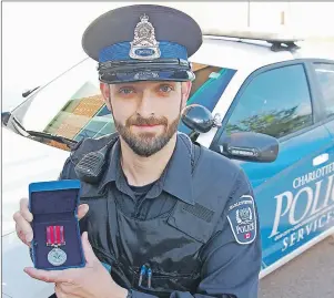  ?? MITCH MACDONALD/THE GUARDIAN ?? Charlottet­own Police Services Const. Mike McGee of St. Mary’s Road received the Governor General’s award this week for bravery for his actions during a fire at the corner of Prince and Grafton streets in the capital city two years ago.