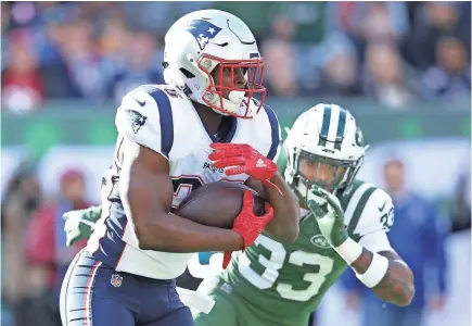  ?? BRAD PENNER/USA TODAY SPORTS ?? Patriots running back Sony Michel sprints past Jets safety Jamal Adams during the first quarter Sunday at MetLife Stadium.