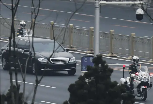  ??  ?? A motorcade believed to be carrying a North Korean delegation was spotted in Changan Avenue, Beijing’s main east-west thoroughfa­re, yesterday amid speculatio­n Kim Jong-un is visiting China’s president Xi Jinping before a planned summit with US...