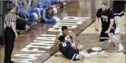  ?? MATT YORK, THE ASSOCIATED PRESS ?? North Carolina’s Kennedy Meeks’ right hand appears out of bounds as he and Gonzaga’s Silas Melson (0) battle for a loose ball late in Monday’s game.