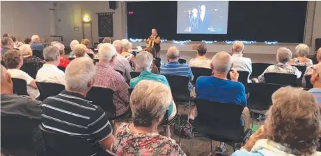  ??  ?? Carlyle Gardens Lifestyle Resort residents enjoy a presentati­on from the Mentally Healthy City Townsville group.