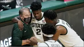  ?? ASSOCIATED PRESS FILE PHOTO ?? Michigan State coach Tom Izzo talks to guard Rocket Watts (2) and forward Aaron Henry during the second half of the team’s Dec. 4 game against Detroit Mercy in East Lansing.