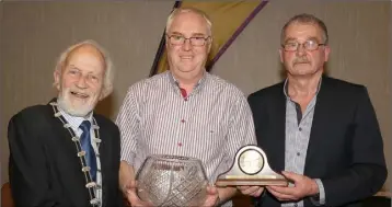  ??  ?? John White of D.M.P. (centre), winner of the lifetime service to athletics award, with Nicky Cowman (President) and Paddy Morgan (Chairman).