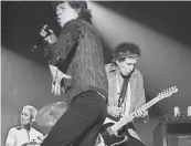  ?? SUN- TIMES PHOTO BY TOM CRUZE ?? Charlie Watts ( from left), Mick Jagger and Keith Richards perform during a Rolling Stones concert at Chicago’s Aragon Ballroom on Sept. 15, 2002. |