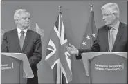  ?? AP/VIRGINIA MAYO ?? EU negotiator Michel Barnier (right) and British Secretary of State David Davis make statements Monday as they arrive at EU headquarte­rs in Brussels.