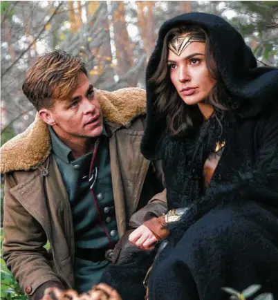  ?? Clay Enos / Warner Bros. ?? Chris Pine, left, and Gal Gadot in a scene from “Wonder Woman.” Despite enthusiast­ic discourse around diversity in film, a report from the University of Southern California­s Annenberg Inclusion Initiative says when it comes to the numbers, little has...