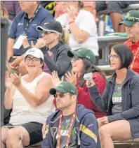  ??  ?? Fans cheer on the Team P.E.I. men’s softball Wednesday during their final game of the preliminar­y round at the Canada Games.