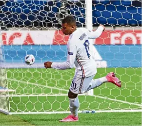  ?? — AFP ?? Bullseye!: France’s Kylian Mbappe scoring against Sweden during the Nations League match at the Friends Arena in Solna.